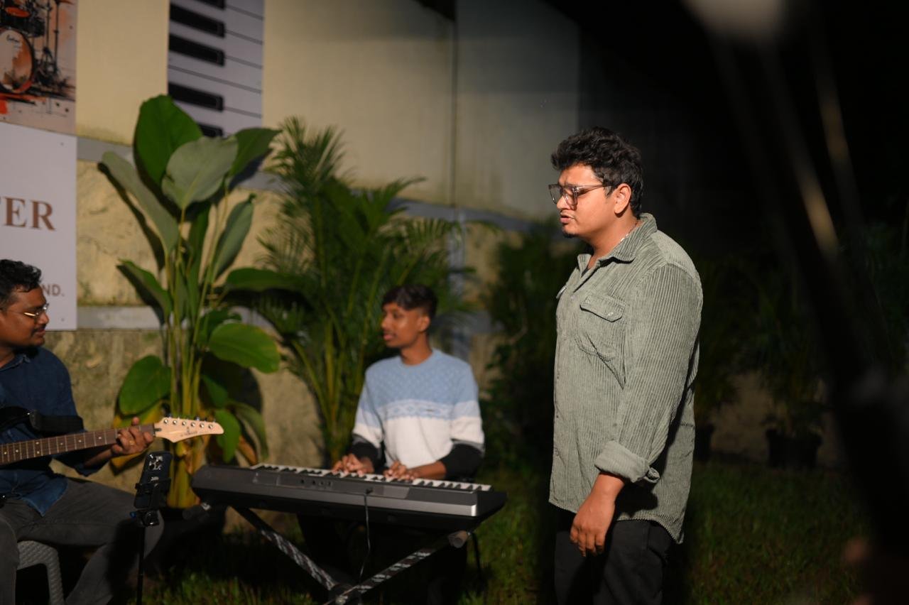 An instructor guiding a keyboard student